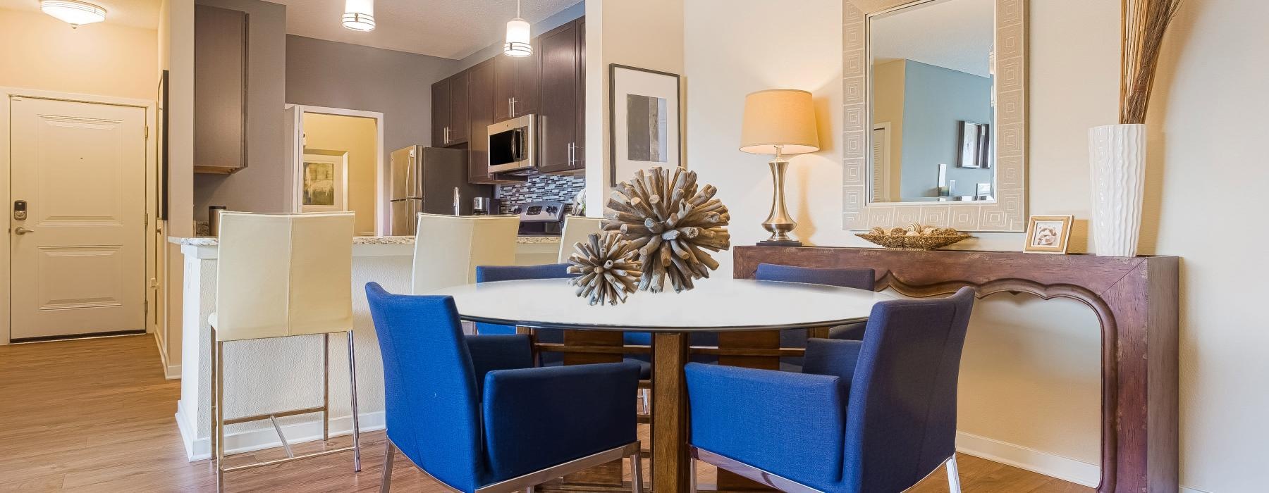 a dining room with a table and chairs