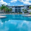 a swimming pool in front of a building
