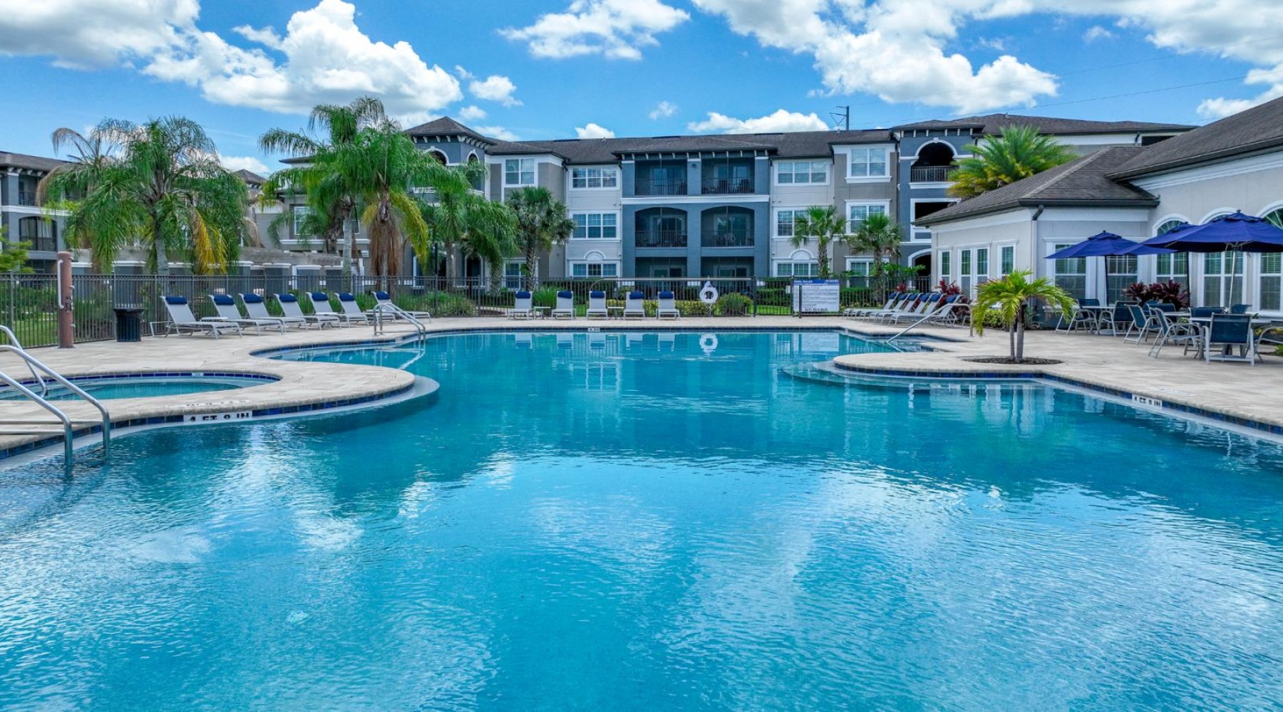 a swimming pool in front of a building