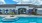 a swimming pool in front of a house