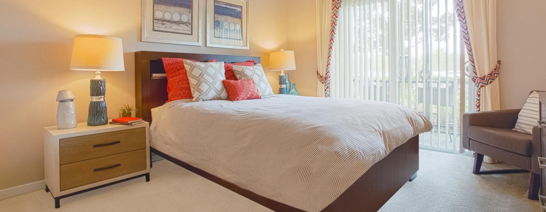 a bedroom with a bed and lamps