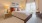 a bedroom with a bed and lamps