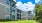 a large building with a lawn in front of it