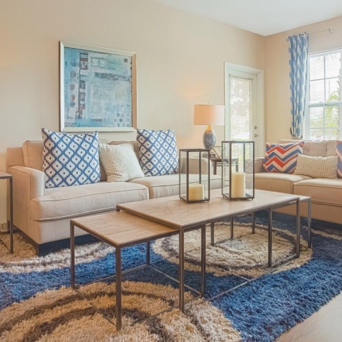 a living room with a couch and coffee table