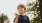 a boy holding an ice cream cone