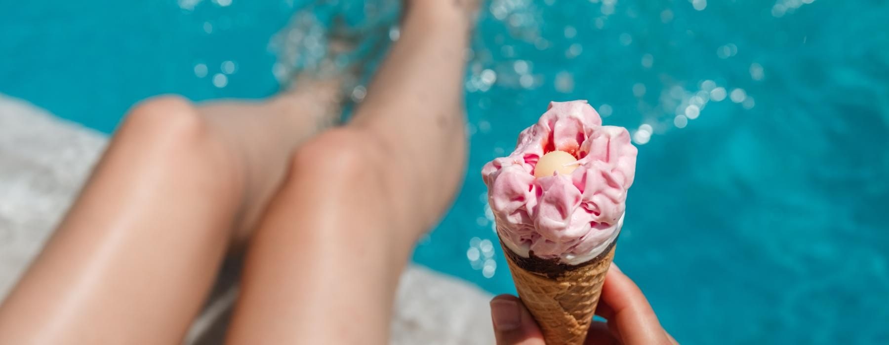 a person holding an ice cream cone